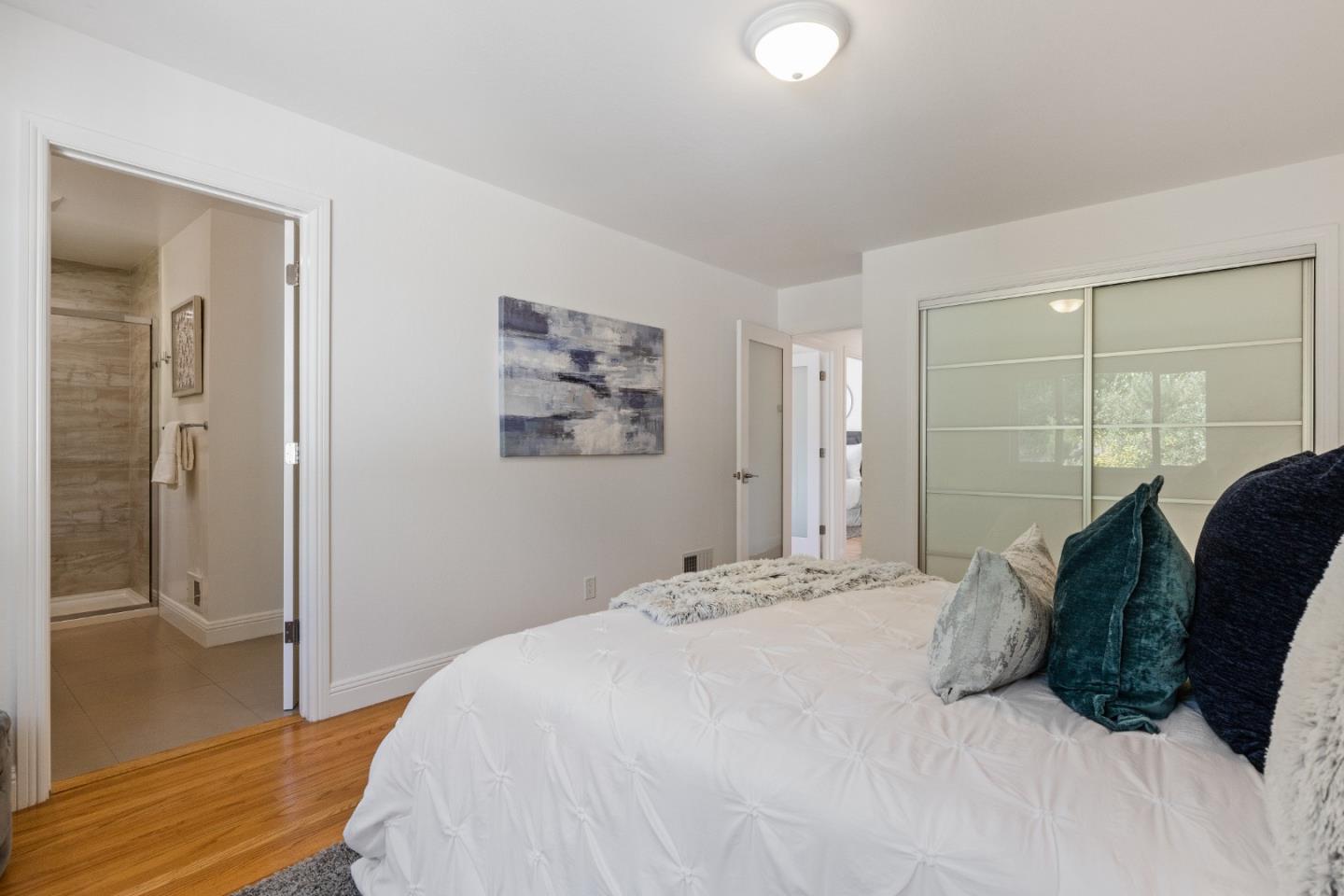 735 Clearfield Drive Millbrae, CA 94030 - Photo 35 of 64 a bedroom with a bed and painting on the wall