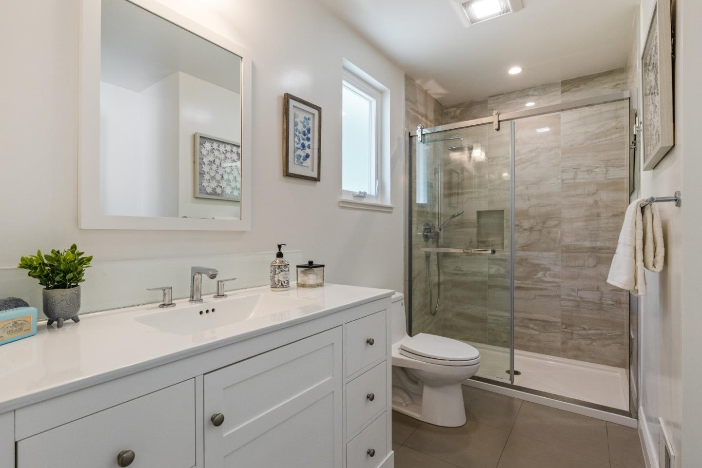 735 Clearfield Drive Millbrae, CA 94030 - Photo 36 of 64 a bathroom with a shower sink vanity mirror and toilet