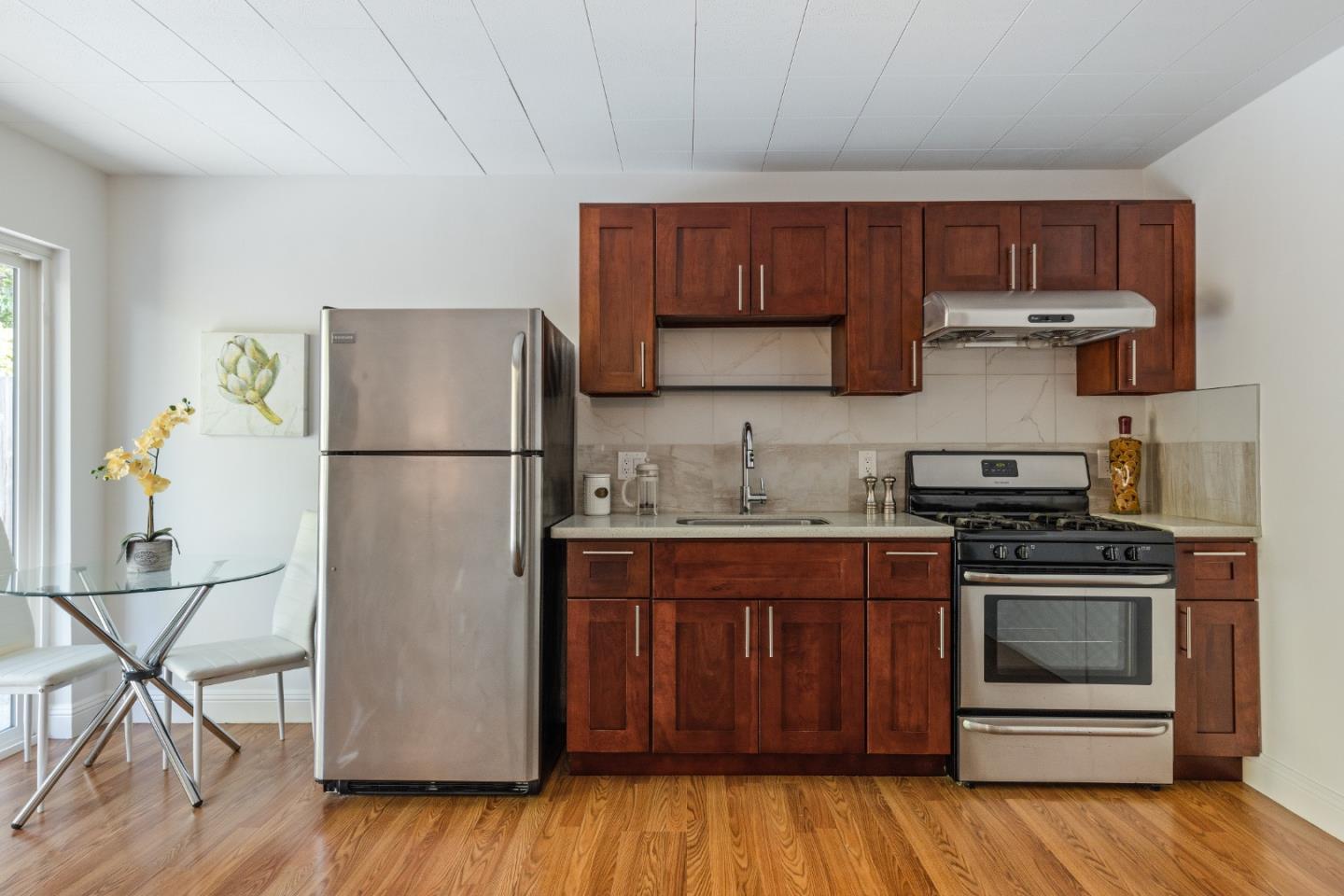 735 Clearfield Drive Millbrae, CA 94030 - Photo 41 of 64 a kitchen with a refrigerator and a stove top oven