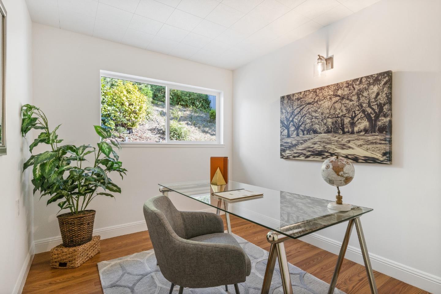 735 Clearfield Drive Millbrae, CA 94030 - Photo 47 of 64 a living room with furniture potted plant and a window