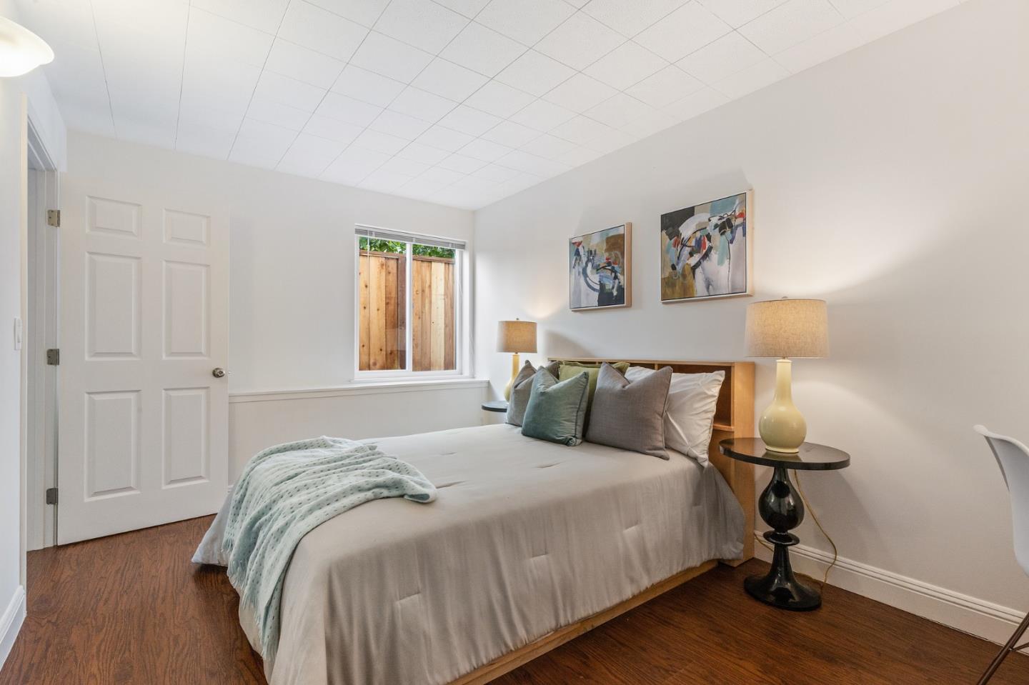735 Clearfield Drive Millbrae, CA 94030 - Photo 56 of 64 a bedroom with a bed and wooden floor