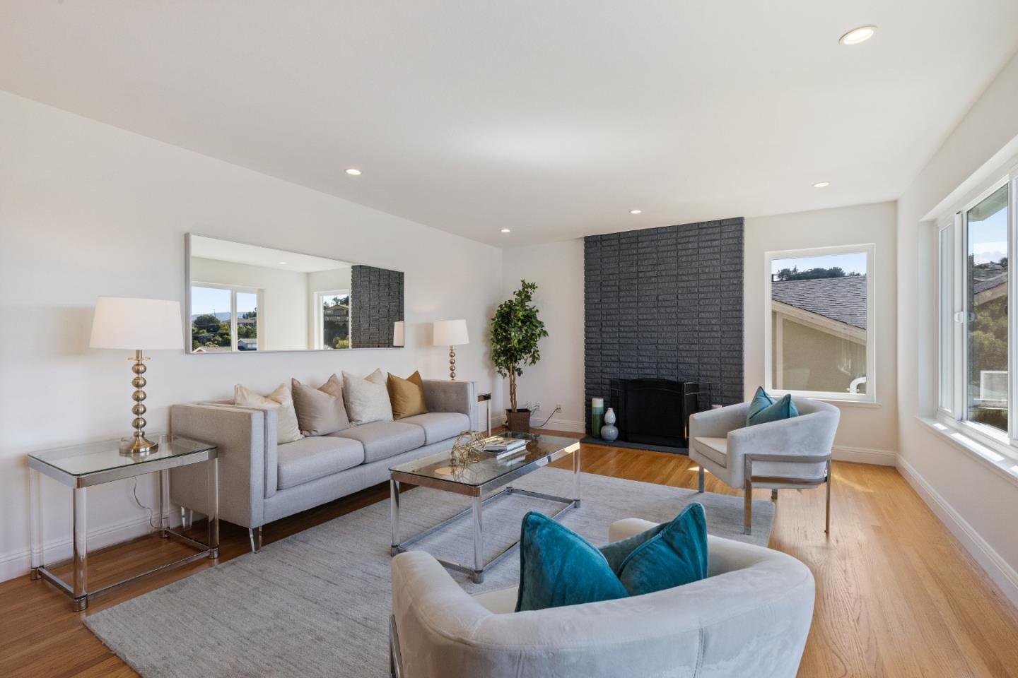 735 Clearfield Drive Millbrae, CA 94030 - Photo 8 of 64 a living room with furniture fireplace and a window