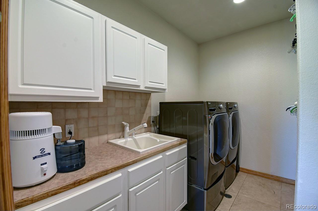 14855 Almstead Street Hudson, CO 80642 - Photo 23 of 39 a view of kitchen and refrigerator