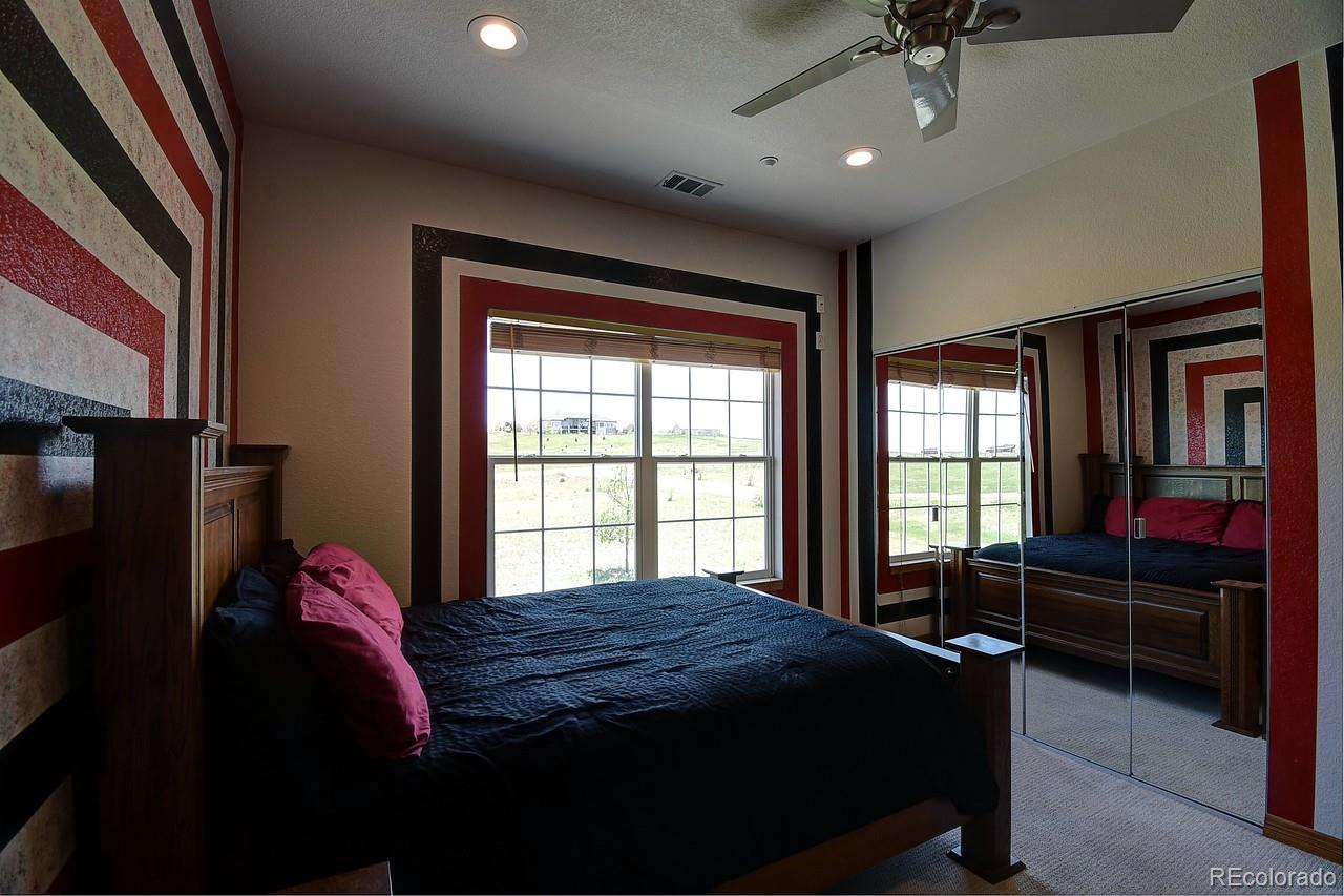 14855 Almstead Street Hudson, CO 80642 - Photo 26 of 39 a bedroom with a bed dresser and a window