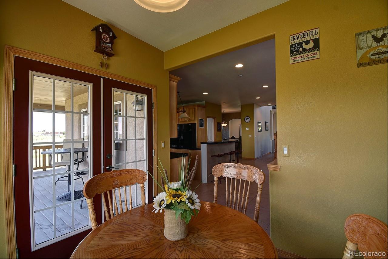 14855 Almstead Street Hudson, CO 80642 - Photo 9 of 39 a view of a livingroom with furniture and windows