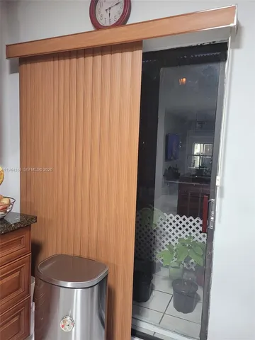 a white toilet sitting next to a bathroom sink and vanity