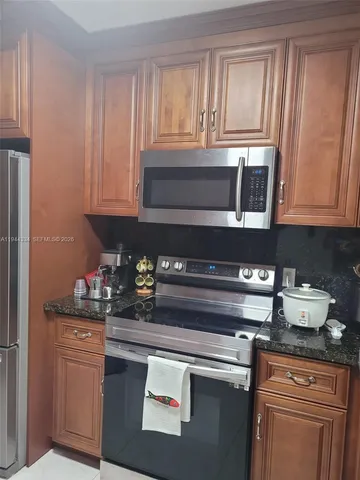 a view of a hallway with paintings on the wall