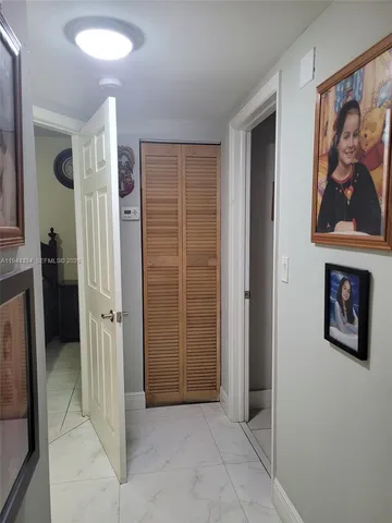 a bedroom with a bed and a lamp