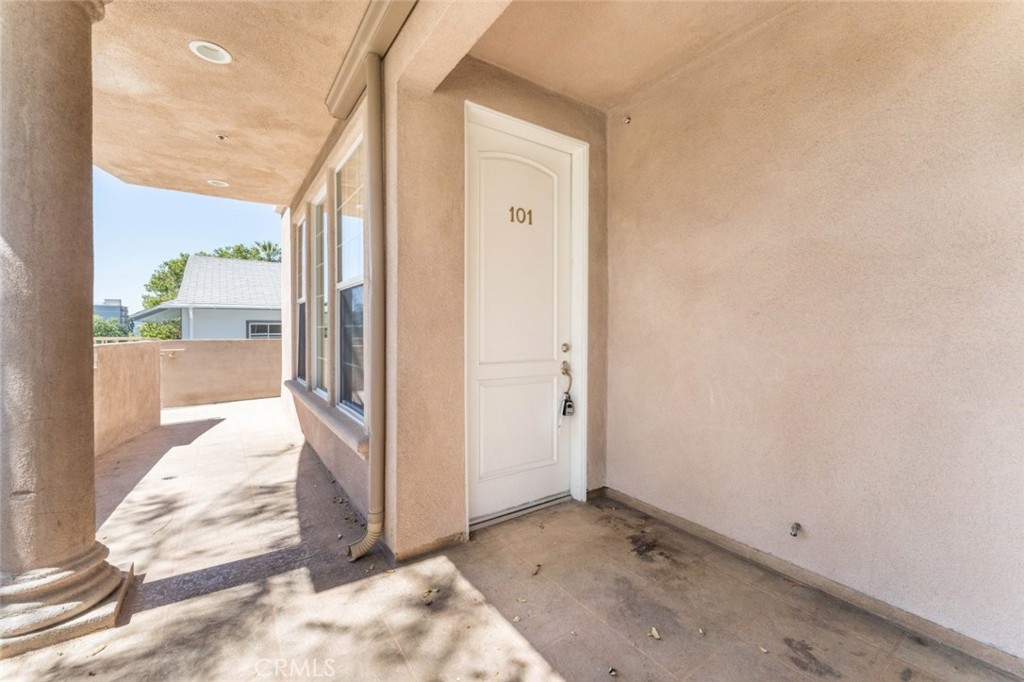 511 East Harvard Road, Unit 101 Burbank, CA 91501 - Photo 3 of 29 a view of a hallway with wooden floor and a bathroom