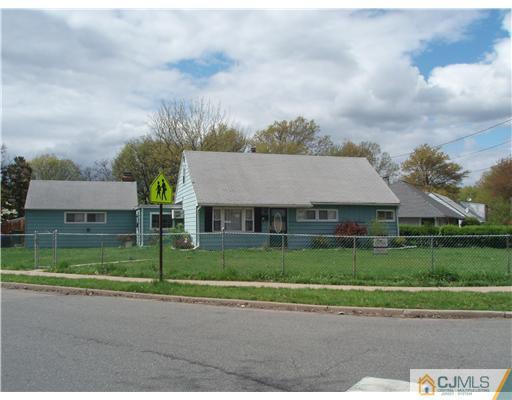 67 Idlewild Road Edison, NJ 08817 - Photo 1 of 6 front view of house with a yard