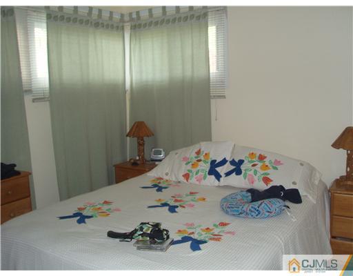 67 Idlewild Road Edison, NJ 08817 - Photo 6 of 6 a bedroom with a bed and a dresser