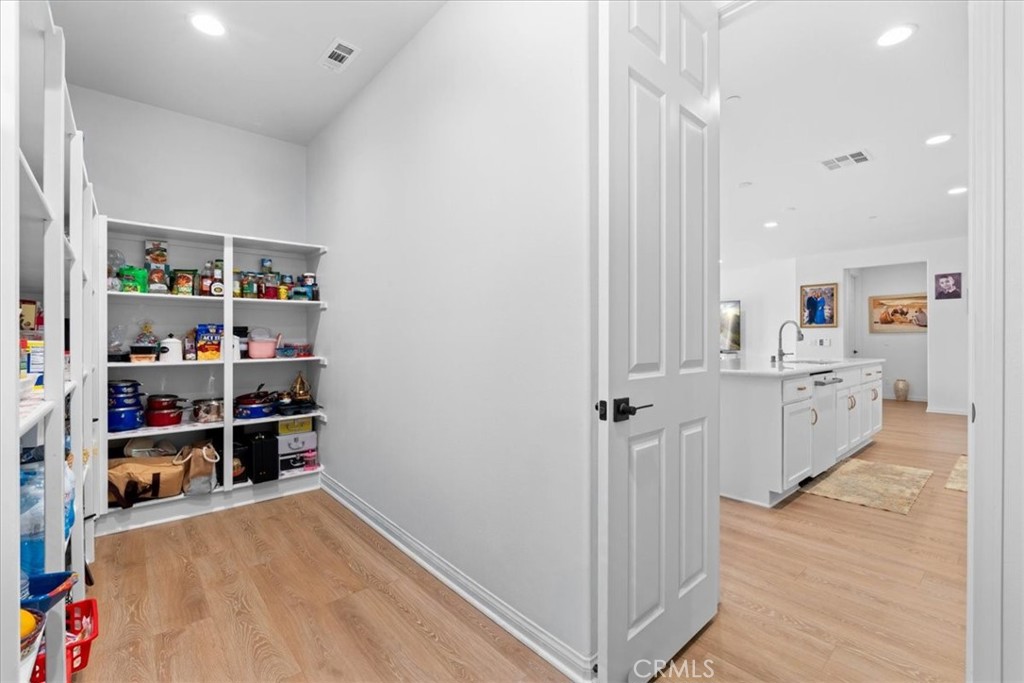 34490 Bloomberry Road Murrieta, CA 92563 - Photo 15 of 43 a view of a kitchen with fridge and closet