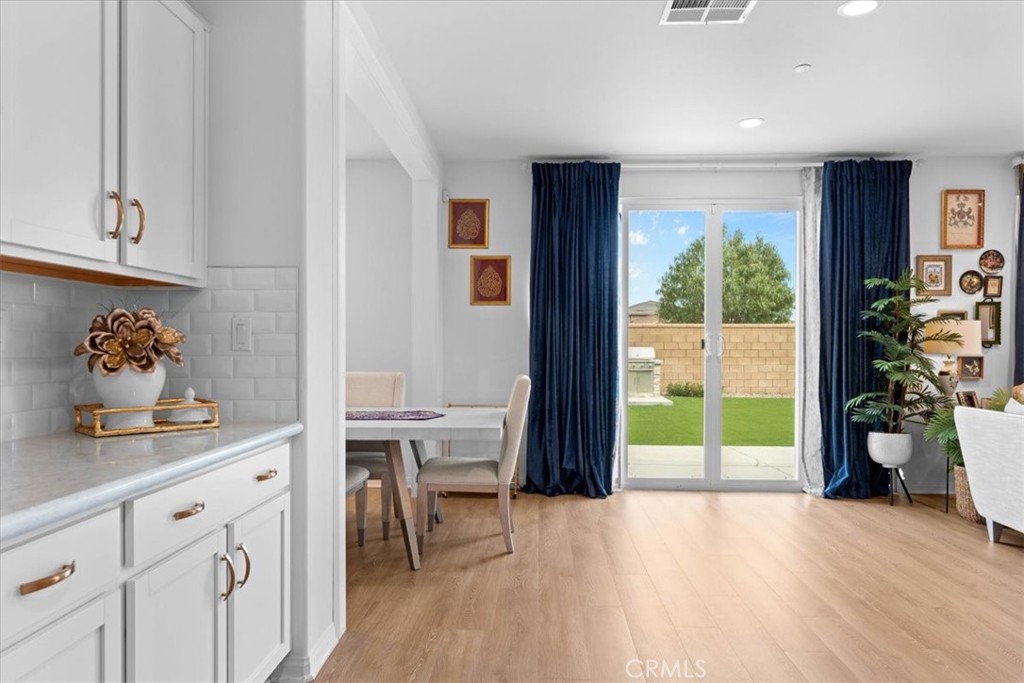 34490 Bloomberry Road Murrieta, CA 92563 - Photo 18 of 43 a very nice looking room with a large window and a wooden floor