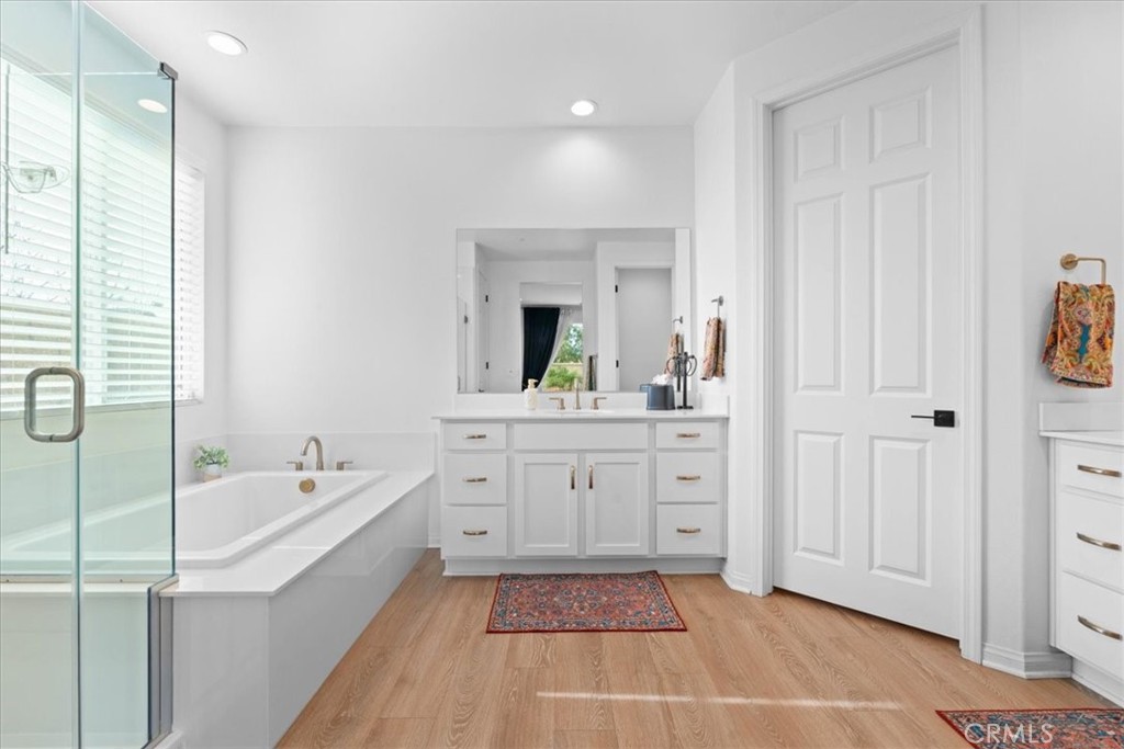 34490 Bloomberry Road Murrieta, CA 92563 - Photo 21 of 43 a spacious bathroom with a tub sink and mirror