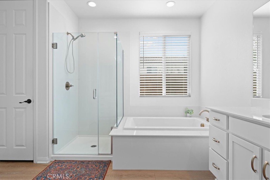 34490 Bloomberry Road Murrieta, CA 92563 - Photo 22 of 43 a bathroom with a tub a sink and a window