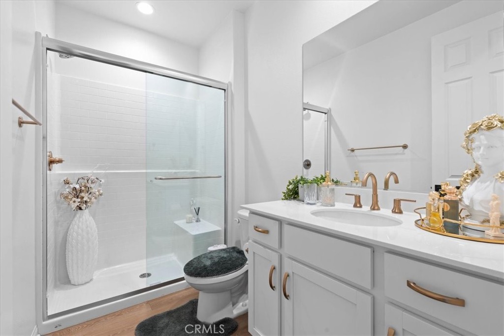 34490 Bloomberry Road Murrieta, CA 92563 - Photo 25 of 43 a bathroom with a granite countertop sink toilet and shower