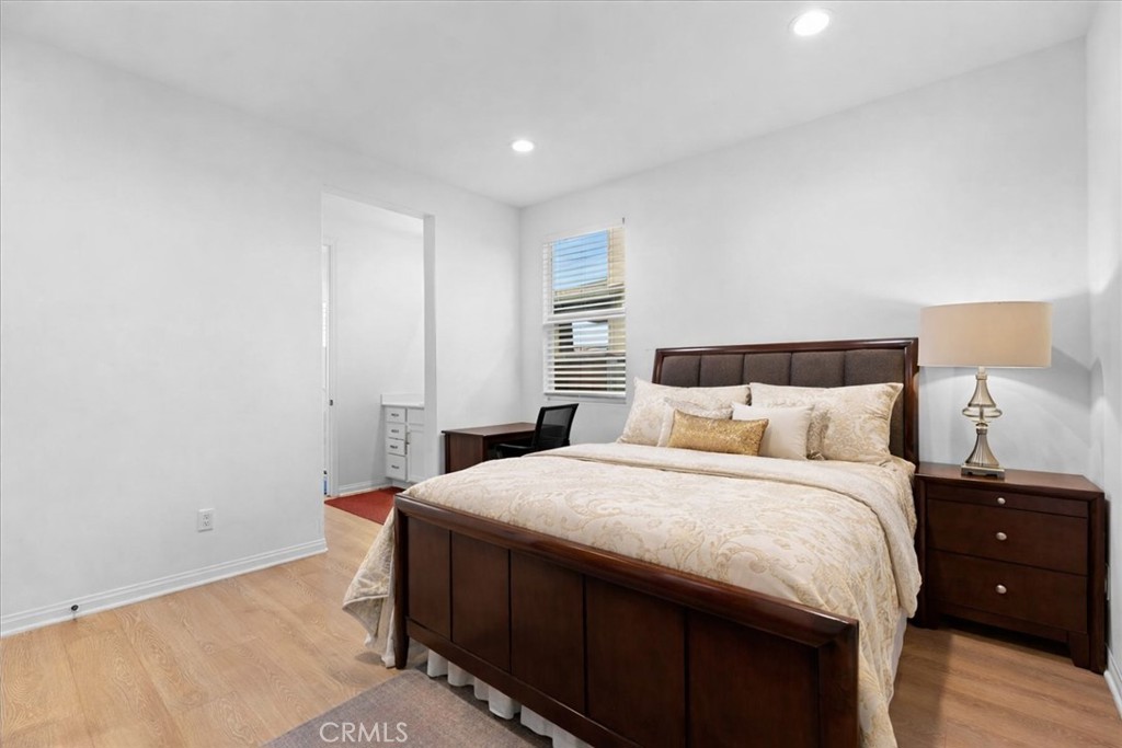 34490 Bloomberry Road Murrieta, CA 92563 - Photo 26 of 43 a bedroom with a bed and a lamp