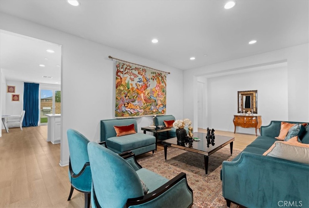 34490 Bloomberry Road Murrieta, CA 92563 - Photo 8 of 43 a living room with furniture and a flat screen tv