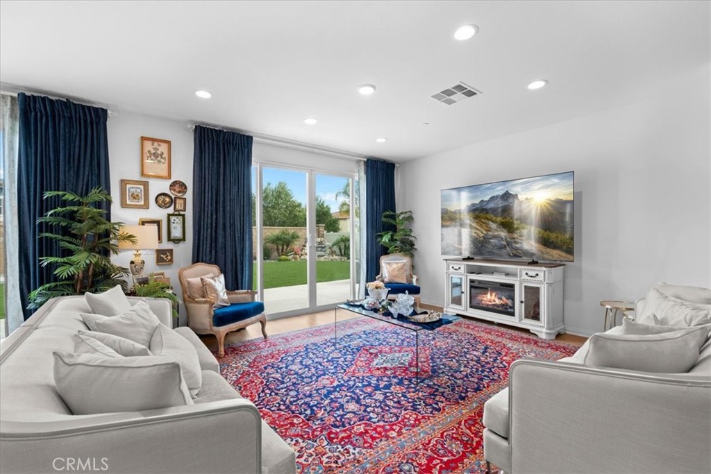 34490 Bloomberry Road Murrieta, CA 92563 - Photo 9 of 43 a living room with furniture and a flat screen tv