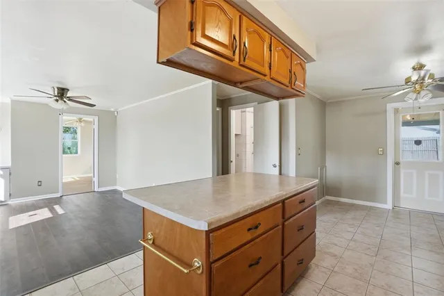 a kitchen with stainless steel appliances granite countertop a sink and a refrigerator