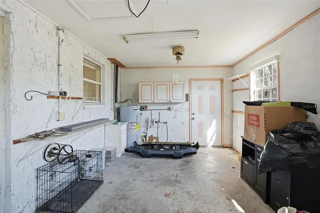 a view of a livingroom with furniture and a window