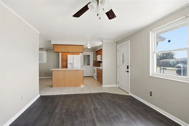 a view of kitchen and wooden floor