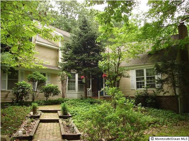 211 Old Mill Road Freehold, NJ 07728 - Photo 1 of 3 front view of a house with a yard