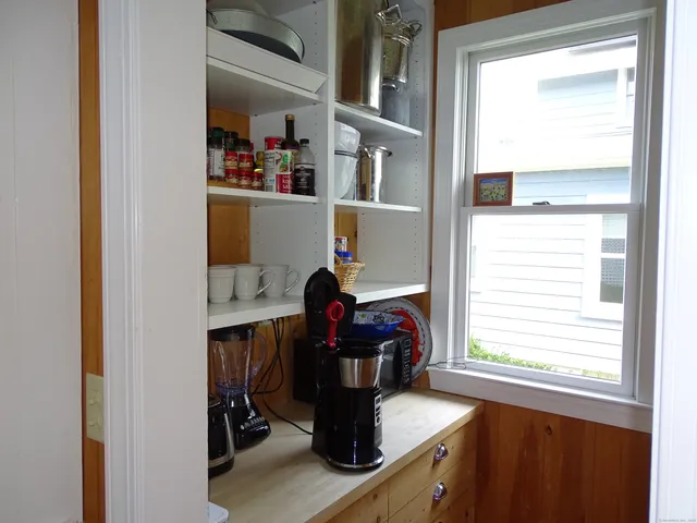 a dining room with furniture and a window