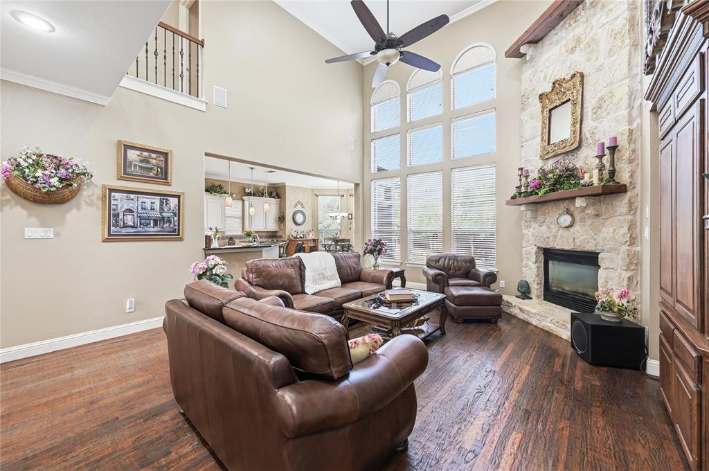 1316 Rio Grande Drive Allen, TX 75013 - Photo 11 of 40 a living room with furniture large window and a fireplace