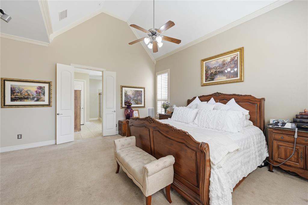 1316 Rio Grande Drive Allen, TX 75013 - Photo 17 of 40 a spacious bedroom with a bed and ceiling fan