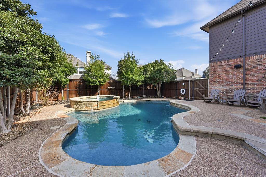 1316 Rio Grande Drive Allen, TX 75013 - Photo 2 of 40 a view of a swimming pool with a patio