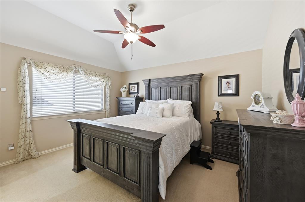 1316 Rio Grande Drive Allen, TX 75013 - Photo 29 of 40 a bedroom with a bed and a dresser