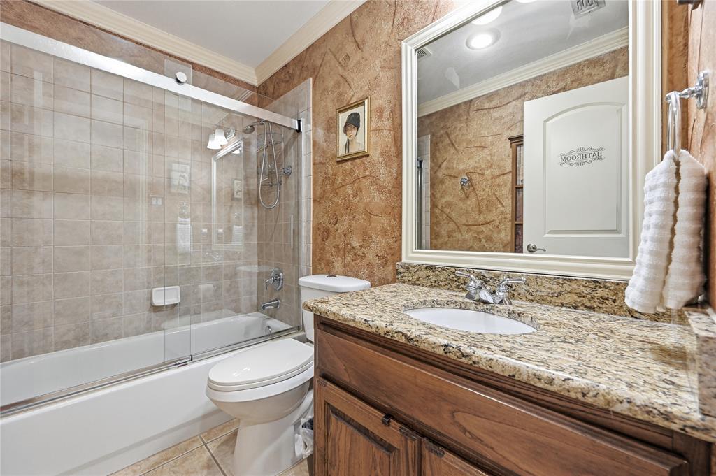 1316 Rio Grande Drive Allen, TX 75013 - Photo 30 of 40 a bathroom with a granite countertop sink toilet and shower