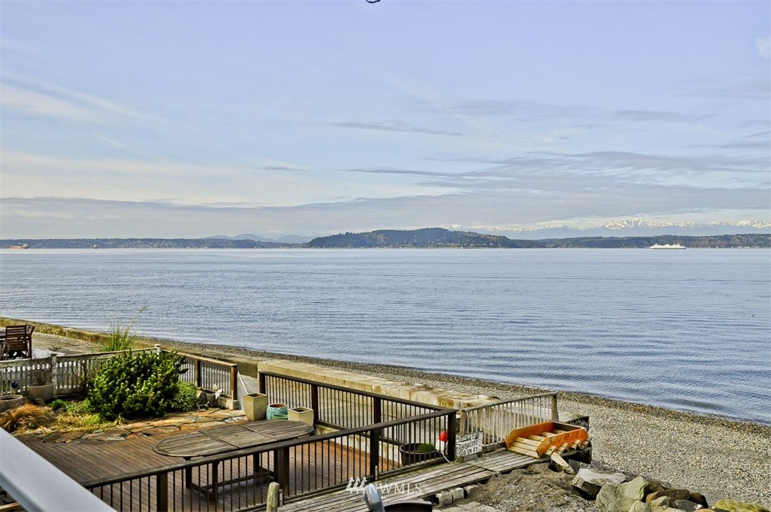 3217 Point Place Southwest Seattle, WA 98116 - Photo 22 of 25 a view of a balcony with chairs and wooden floor