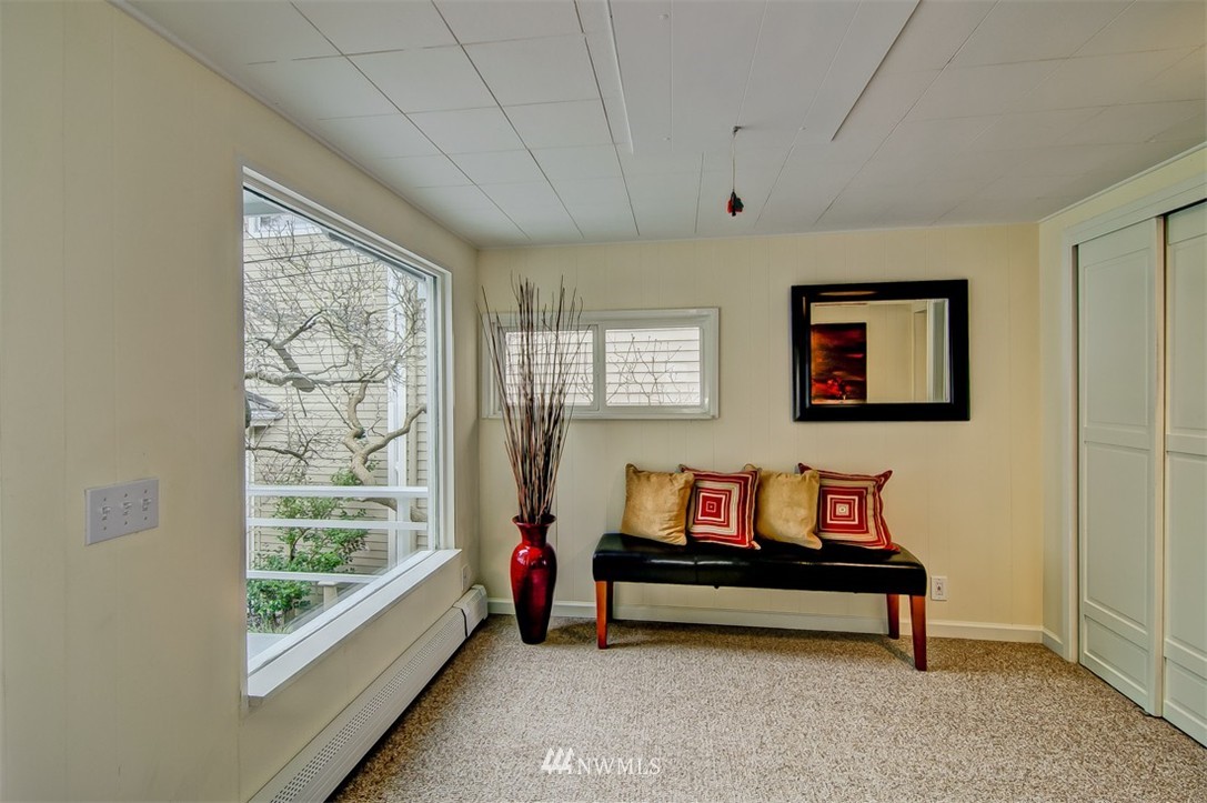 3217 Point Place Southwest Seattle, WA 98116 - Photo 7 of 25 a sitting area with furniture and a window