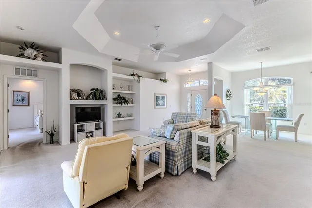 a kitchen with granite countertop a sink and white cabinets