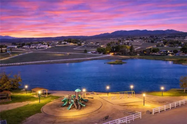 a view of a swimming pool with a table and chairs