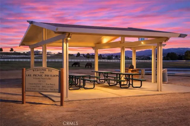 a view of a tables and chairs in patio