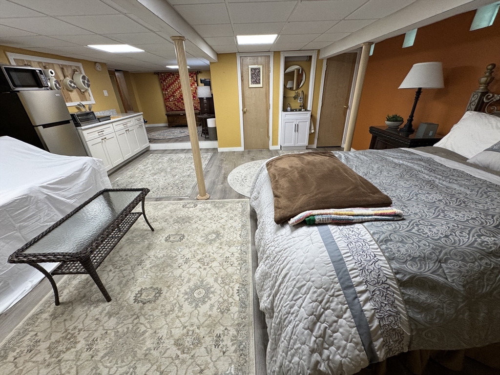 a bedroom with a bed and a chair