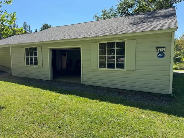 a house with garden in front of it