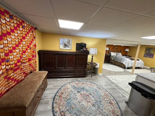 a living room with furniture and a rug