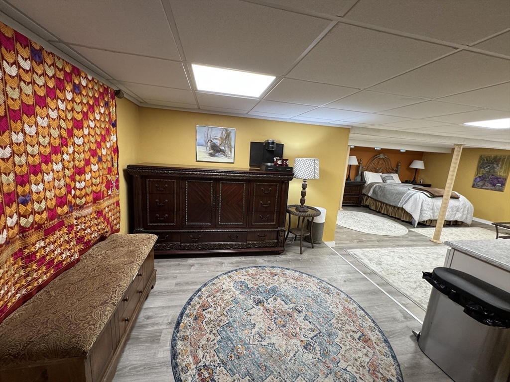 1292 Lenox Road, Unit 1 Richmond, MA 01254 - Photo 4 of 16 a living room with furniture and a rug