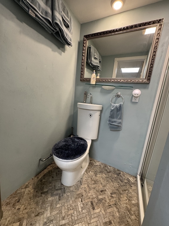 1292 Lenox Road, Unit 1 Richmond, MA 01254 - Photo 6 of 16 a bathroom with a toilet and a sink