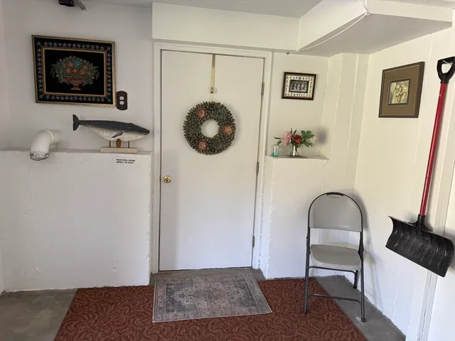 a bedroom with a bed and a chair