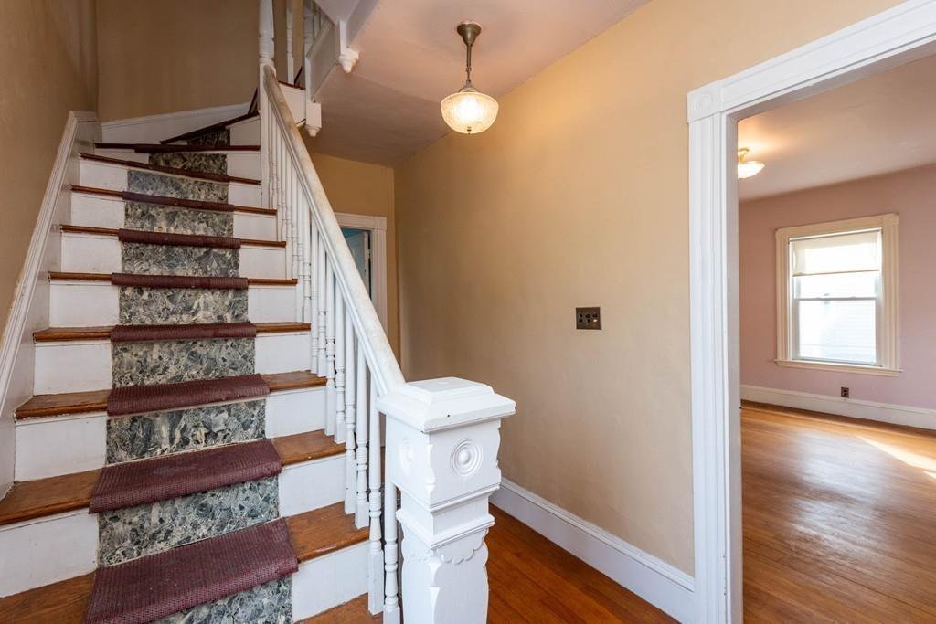 175 Riverside Avenue Medford, MA 02155 - Photo 13 of 38 a view of a hallway with wooden floor and entryway