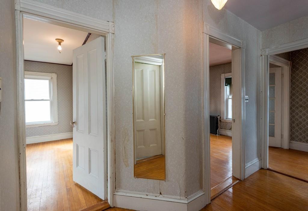 175 Riverside Avenue Medford, MA 02155 - Photo 15 of 38 a view of hallway with wooden floor