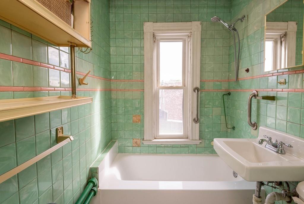 175 Riverside Avenue Medford, MA 02155 - Photo 16 of 38 a bathroom with a sink a toilet and shower