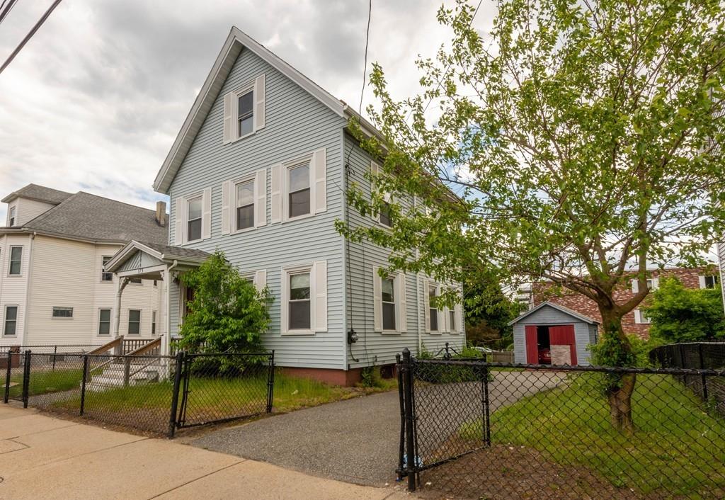 175 Riverside Avenue Medford, MA 02155 - Photo 2 of 38 a front view of a house with a yard
