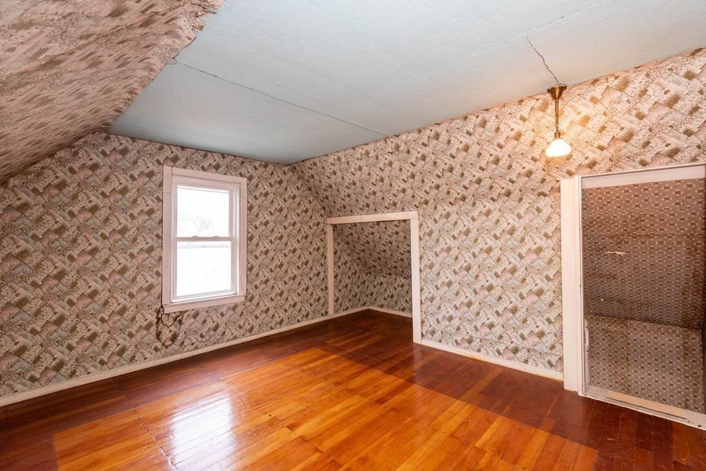 175 Riverside Avenue Medford, MA 02155 - Photo 24 of 38 an empty room with wooden floor and windows