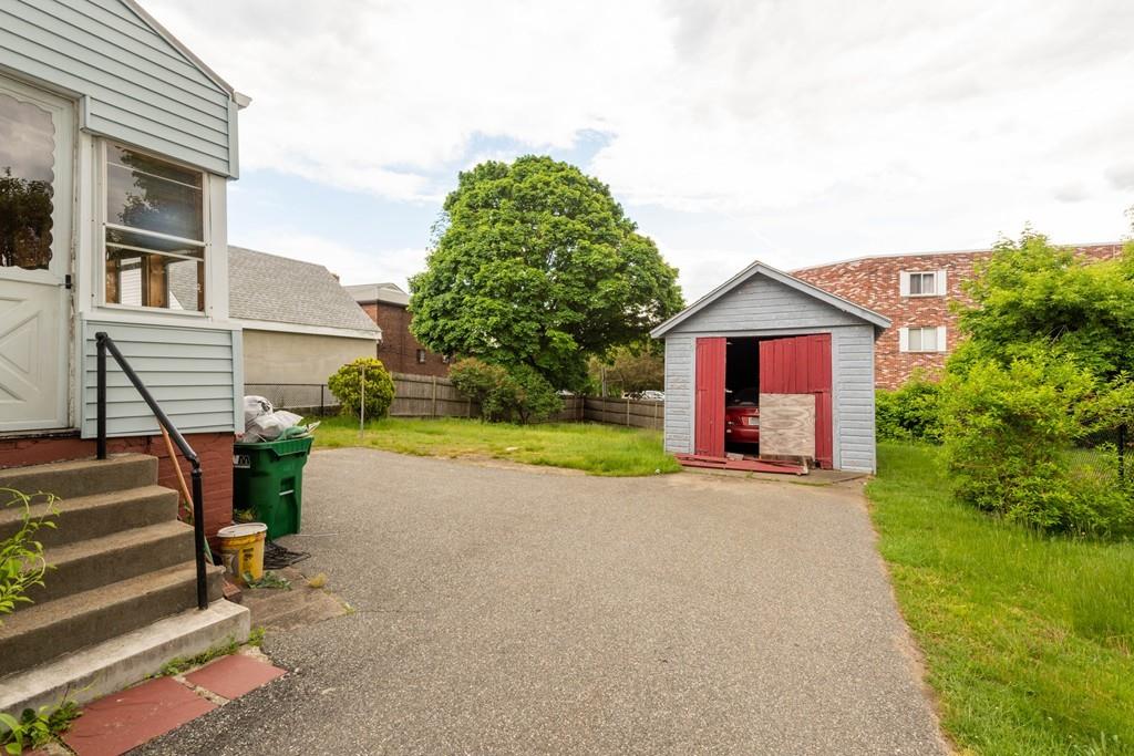 175 Riverside Avenue Medford, MA 02155 - Photo 34 of 38 a view of a house with a yard and tree s